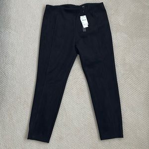 Faux leather, velvety feel straight leg pants. Stretchy waist.